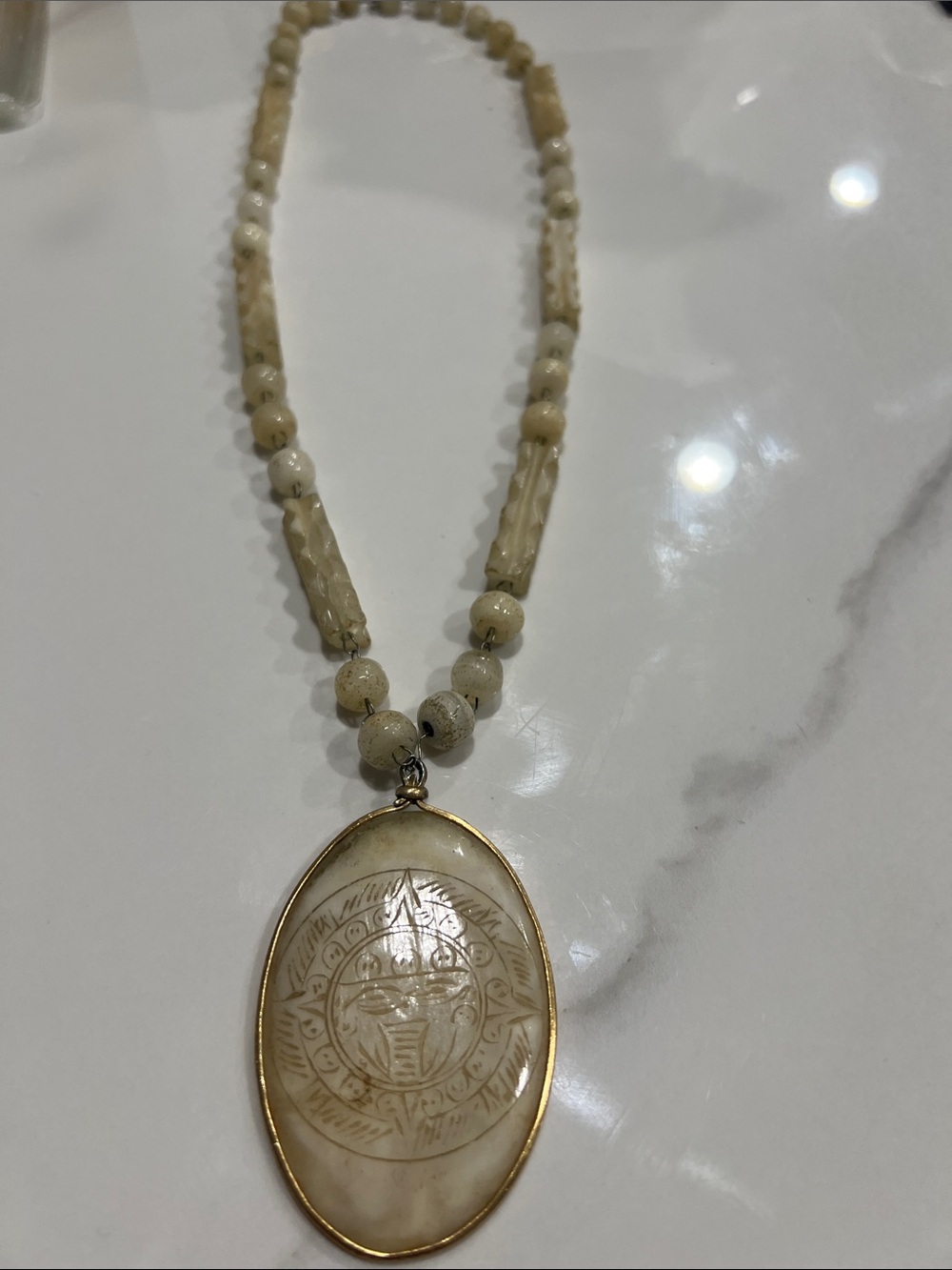 B#80-vintage artisan necklace features a hand-carved stone or shell Aztec/